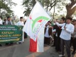 Bupati Tangerang Moch Maesyal Rasyid kibarkan bendera lepas Pawai Taaruf 1 Muharram 1448 H di Citra Raya Panongan