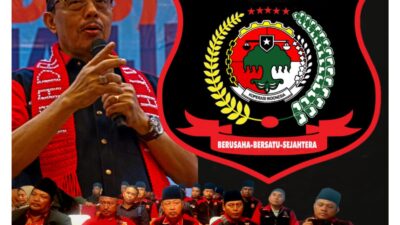 Ketum Madas Nusantara KRH HM Jusuf Rizal berpidato dengan logo Koperasi Madas Nusantara